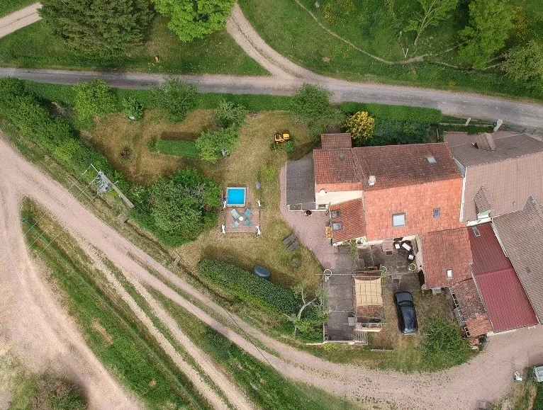 Top view of Carter Maison, its garden and the open fields around it
